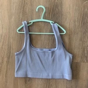 Women’s small cropped blue tank top.